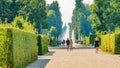 Panoramic view over garden, pools, flowers, fountains and old statues in the city park of Potsdam, a German town of statues and