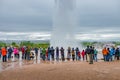 Panoramic view over Geyser, Geysir in South Iceland, at Strokkur, Golden Circle, at summer with dramatic sky and tourists watching