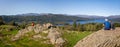 Panoramic view over Lake Windemere from the top of Brant Fell with walkers enjoying the view in The Lake District, Cumbria, UK Royalty Free Stock Photo