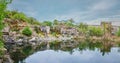 Panoramic view over a landscape of lake, rock and forest Royalty Free Stock Photo
