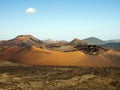 Panoramic view over lava field on crater and cone of red volcanoes in Timanfaya NP, Lanzarote, Canary Islands
