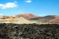 Panoramic view over lava field on crater and cone of red volcanoes in Timanfaya NP, Lanzarote, Canary Islands