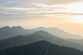 Panoramic view over layers of mountain ridges in the sunset light