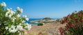 Panoramic view over Lindos village with ruins of ancient Acropolis. Island of Rhodes. Greece. Europe Royalty Free Stock Photo