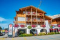 Panoramic view over magical Dolomite peaks, forests and hotels at sunny day and blue sky, Colfosco, Corvara, at Puez-Geisler, Puez