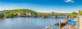 Panoramic view over magnificent Vltava river with Saint Vitus Cathedral near Charles Bridge and walking embarkment in historical Royalty Free Stock Photo