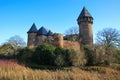 Panoramic view over moat on medieval water castle and defensive tower with bare trees in winter against blue sky - Krefeld Linn Royalty Free Stock Photo