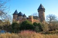 Panoramic view over moat on medieval water castle and defensive tower with bare trees in winter against blue sky - Krefeld Linn Royalty Free Stock Photo