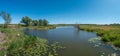 Panoramic view over a pond near Elbe river with water lilies at sunny day and blue sky, Magdeburg, Germany Royalty Free Stock Photo