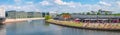 Panoramic view over relaxing people at the cafe Capital Beach at Spree channel, Spreebogen, with a tour boat in historical and