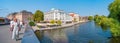 Panoramic view over river Havel with street cafe and restaurants near Saint Nicholas Church in Potsdam at blue sky, Germany, with