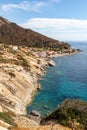 Panoramic view over rocky beach of little village Pomonte and coastal road in autumn at Elba Island, Italy Royalty Free Stock Photo