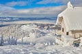 Panoramic view over the ski slope Poiana Brasov ski resort in Transylvania, Pine forest covered in snow on winter season,Mountain