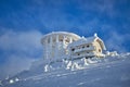 Panoramic view over the ski slope Poiana Brasov ski resort in Transylvania, Pine forest covered in snow on winter season,Mountain