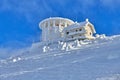 Panoramic view over the ski slope Poiana Brasov ski resort in Transylvania, Pine forest covered in snow on winter season,Mountain