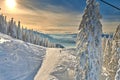 Panoramic view over the ski slope, ski resort in Transylvania, Pine forest covered in snow on winter season,Mountain landscape in Royalty Free Stock Photo