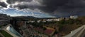 Panoramic view over Spanish village showing thunderstorm approaching