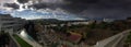 Panoramic view over Spanish village showing thunderstorm approaching