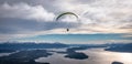 Panoramic view of paragliding over Nahuel Huapi lake and mountains of Bariloche in Argentina, with snowed peaks in the background Royalty Free Stock Photo