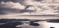 Panoramic view of paragliding over Nahuel Huapi lake and mountains of Bariloche in Argentina, with snowed peaks in the background Royalty Free Stock Photo