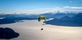 Panoramic view of paragliding over Nahuel Huapi lake and mountains of Bariloche in Argentina, with snowed peaks in the background Royalty Free Stock Photo