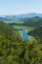 Panoramic view at Pavlova Strana on the river of Crnojevi?a flowing through green lands to Lake Skadar