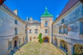 Panoramic view on the pebbled inner courtyard of historic Olesko Castle, Ukraine Royalty Free Stock Photo