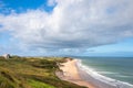 Panoramic view of people walking on Whiterocks Beach