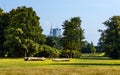 Panoramic view of Pole Mokotowskie field park with skyscrapers of Srodmiescie downtown district of Warsaw city center in Poland