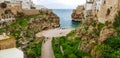 Panoramic view of of Polignano a Mare beach,  town on the rocks, Italian town of the metropolitan city of Bari in Puglia region, Royalty Free Stock Photo