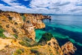 Panoramic view, Ponta da Piedade near Lagos in Algarve, Portugal. Cliff rocks and tourist boat on sea at Ponta da Piedade, Algarve