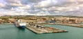 Panoramic view of port of Civitavecchia. Cruise ships, cargo ships and tourist ferries stand in harbor