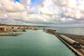 Panoramic view of port of Civitavecchia. Cruise ships, cargo ships and tourist ferries stand in harbor