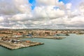 Panoramic view of port of Civitavecchia. Cruise ships, cargo ships and tourist ferries stand in harbor