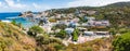 Panoramic view of the port of the Ponza island in summer. Coloured houses, boats, ferry in the harbour of island of Ponza, Italy