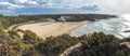 Panoramic view of Praia de Odeceixe Mar Surfer beach with golden sand, atlantic ocean waves, river bend and white houses Royalty Free Stock Photo