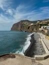 Panoramic view of Praia de Vigario in Camara de Lobos on Madeira island, Portugal, Europe. Black stone beach in Atlantic Ocean
