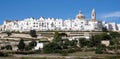 Panoramic view of the pretty town of Locorontondo, Puglia, southern Italy. Photo shows the town at the top of the hill