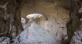 Panoramic view of Prohodna cave also known as God`s eyes near Karlukovo village, Bulgaria. Colorful cave formation with giant entr Royalty Free Stock Photo