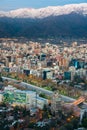 Panoramic view of Providencia district with Mapocho River and the snowed Andes mountain range in the back. Royalty Free Stock Photo