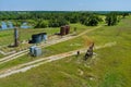 Pump jack on the of oil-gas pump jack out in field behind Oklahoma prairie Royalty Free Stock Photo