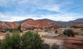 Panoramic view of Purmamarca town with Cerro de los siete colores on background - Purmamarca, Jujuy, Argentina Royalty Free Stock Photo