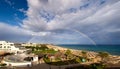 Panoramic view of rainbow over sea and beach Royalty Free Stock Photo