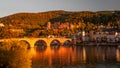 Panoramic view during red sunset at old bridge, downtown and castle in Heidelberg, Germany Royalty Free Stock Photo