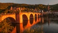 Panoramic view during red sunset at old bridge, downtown and castle in Heidelberg, Germany Royalty Free Stock Photo