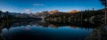 Panoramic view of the reflection of the Sawtooth Mountains in the  Alice Lake Royalty Free Stock Photo