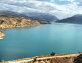 Mountain reservoir with turquoise water Royalty Free Stock Photo