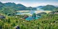 Panoramic view of  Rijeka Crnojevica river, Skadar lake location. Bright summer scene of Karuc village, Montenegro, Europe. Royalty Free Stock Photo