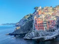 Panoramic view of Riomaggiore town in Cinque Terre in an early morning Royalty Free Stock Photo