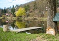 Panoramic view of river with emerald water and boats in the early spring Royalty Free Stock Photo